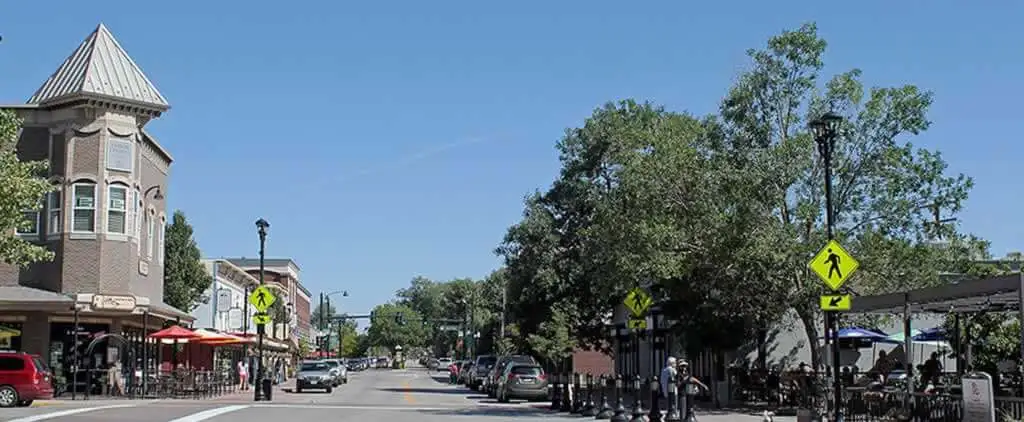 In the heart of Parker, Colorado, a moving truck awaits, poised to carry dreams and memories to new horizons amidst the town's picturesque landscape.