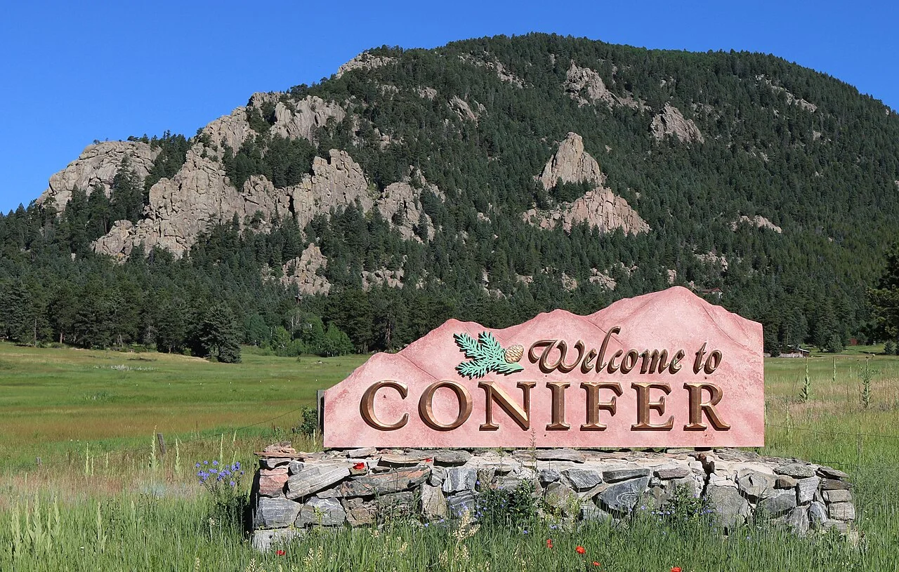 Welcome to Conifer sign along U.S. 285 in Conifer, Colorado